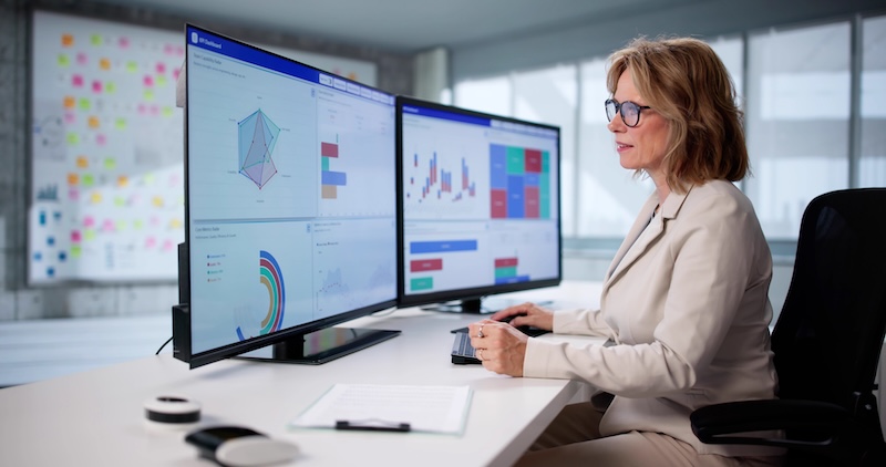 Senior woman analyzes financial data